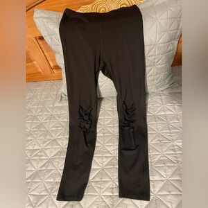 Adorable yet edgy black distressed-look active leggings with inner waist pocket